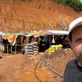 Ron Bensimon visiting a local mining camp heavily integrated in natural African red soil